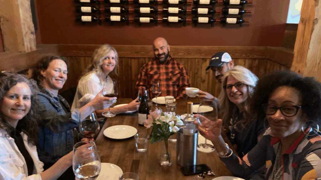 Group of people having dinner at at winery
